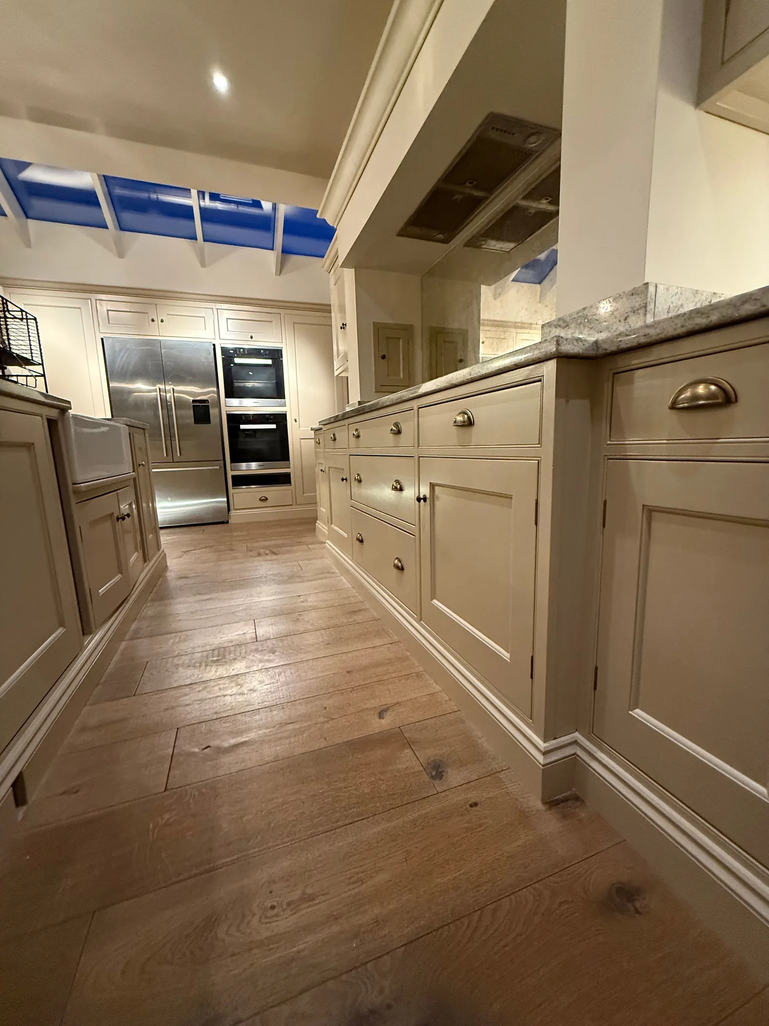 Cream in frame kitchen with an oak floor