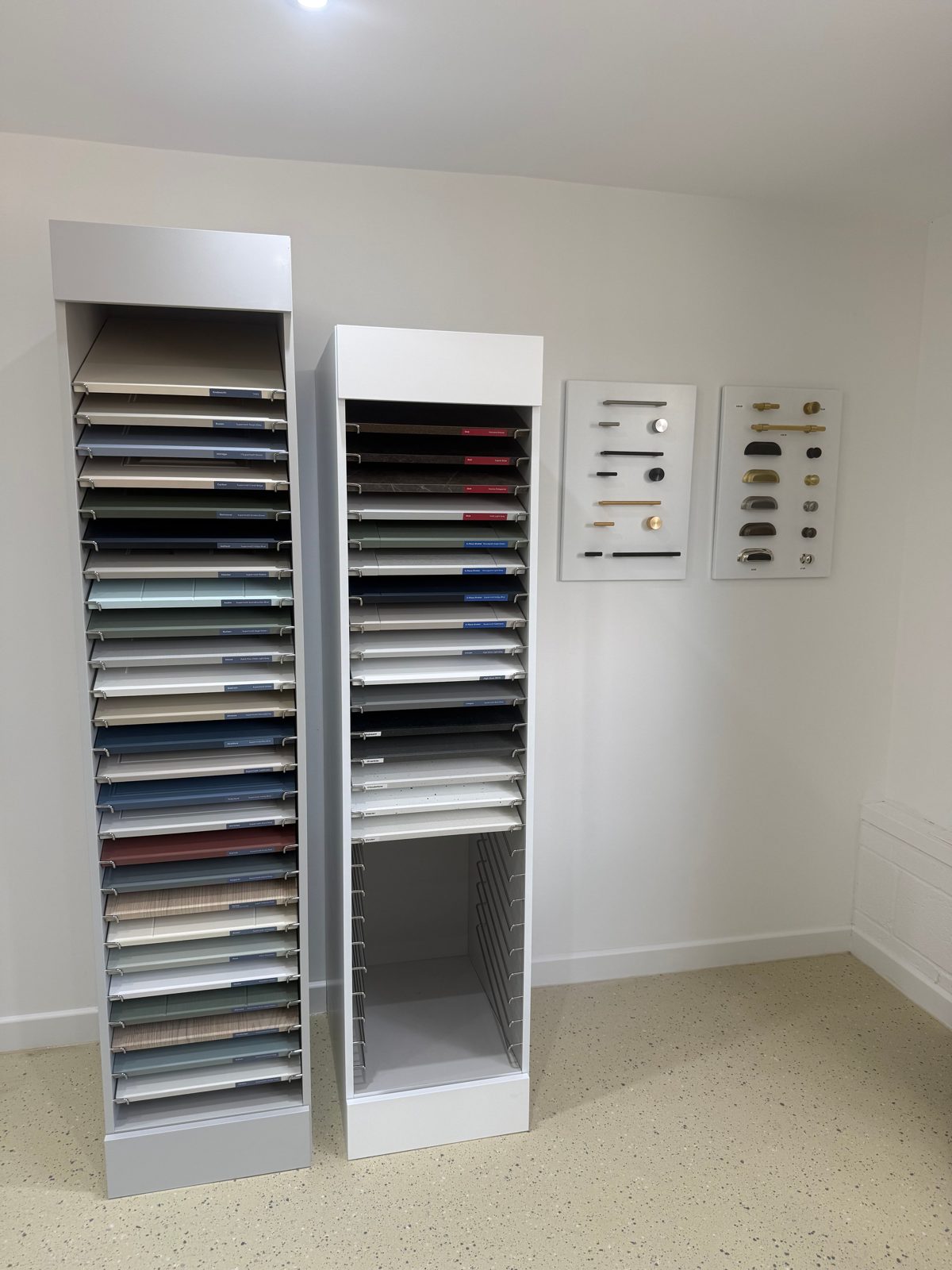 Door finish samples and cabinet handle boards in the showroom
